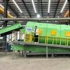 Drum screening machine voor een automatisch systeem voor het sorteren van vaste stoffen in een afvalsorteringsinstallatie